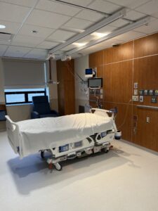 ICU patient room with hospital bed and wall-mounted medical equipment at Memorial Hospital Belleville