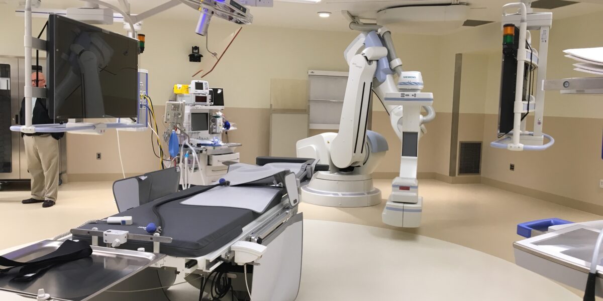 Hybrid operating room at Memorial Hospital Belleville featuring surgical table, robotic imaging equipment, and integrated mechanical systems