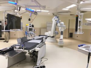 Hybrid operating room at Memorial Hospital Belleville featuring surgical table, robotic imaging equipment, and integrated mechanical systems
