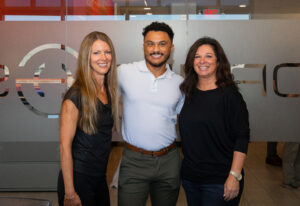 Xavier Diggs standing outdoors with Bridgett Jacquot and Jane, his two mentors at Horner & Shifrin.