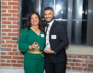 Xavier Diggs and Bridgett Jacquot standing together, Xavier holding the H&S Rising Star Award.